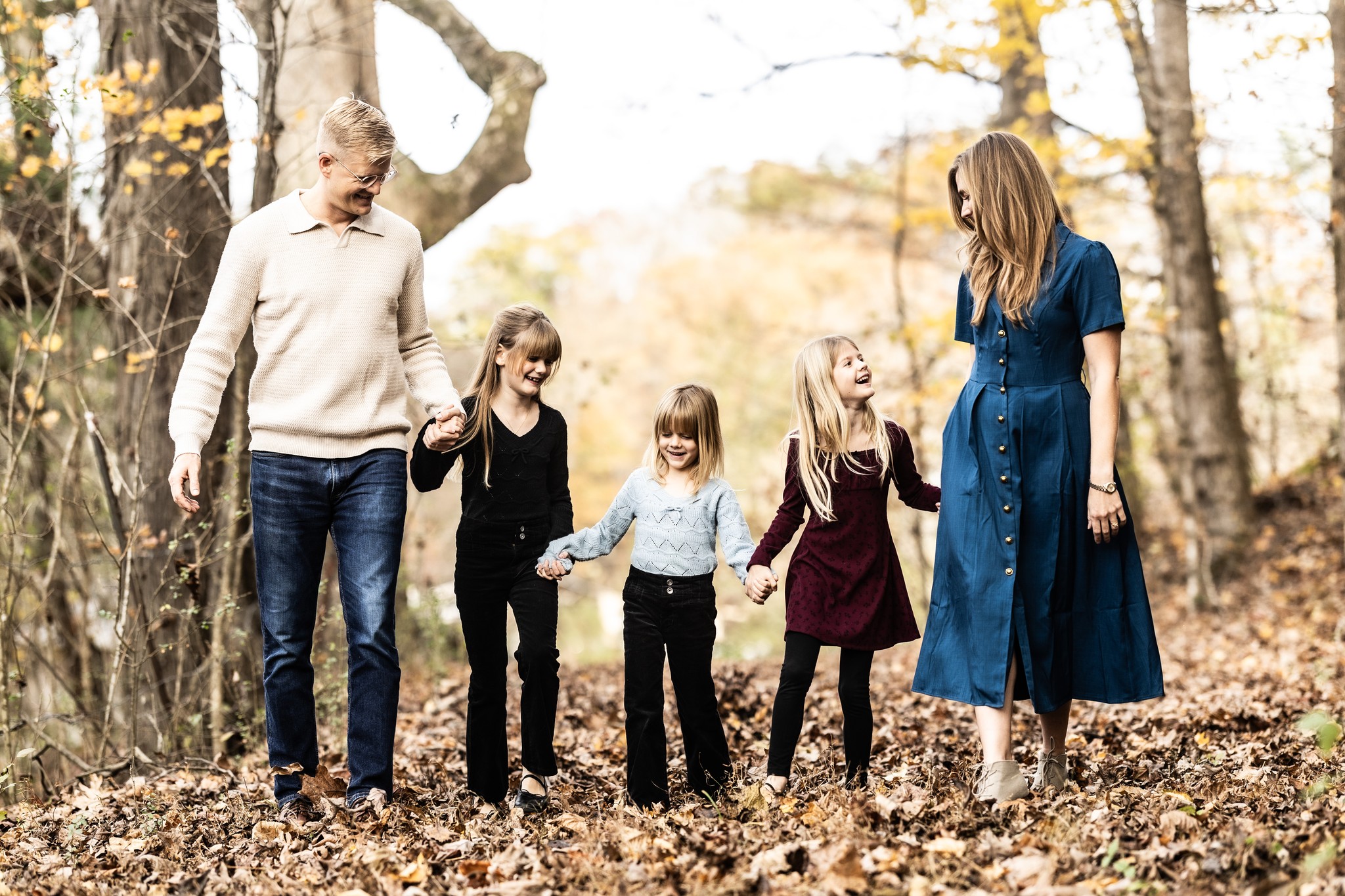 Justus Stout with his wife and three daughters walking through the woods